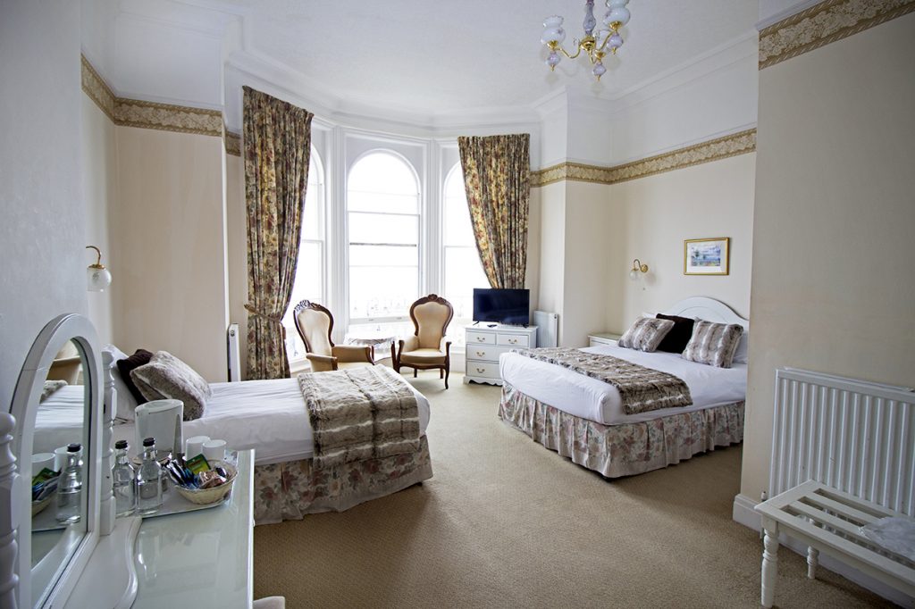 Overview of the family room, one double and one single bed.