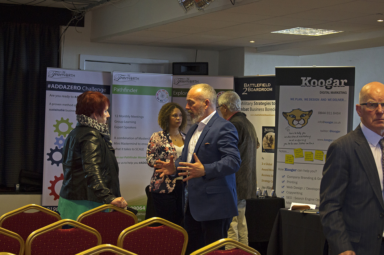 Business men and women networking together.